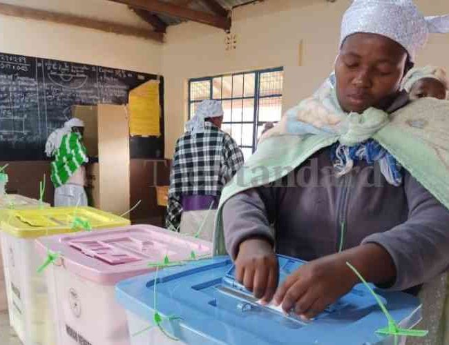 Lilian Solomon Sibindi votes at Kinoo Primary School in Kikuyu, Kiambu County.