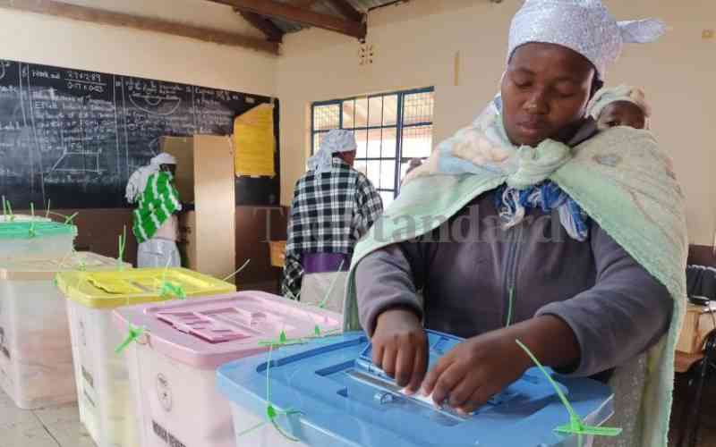 Lilian Solomon Sibindi votes at Kinoo Primary School in Kikuyu, Kiambu County.